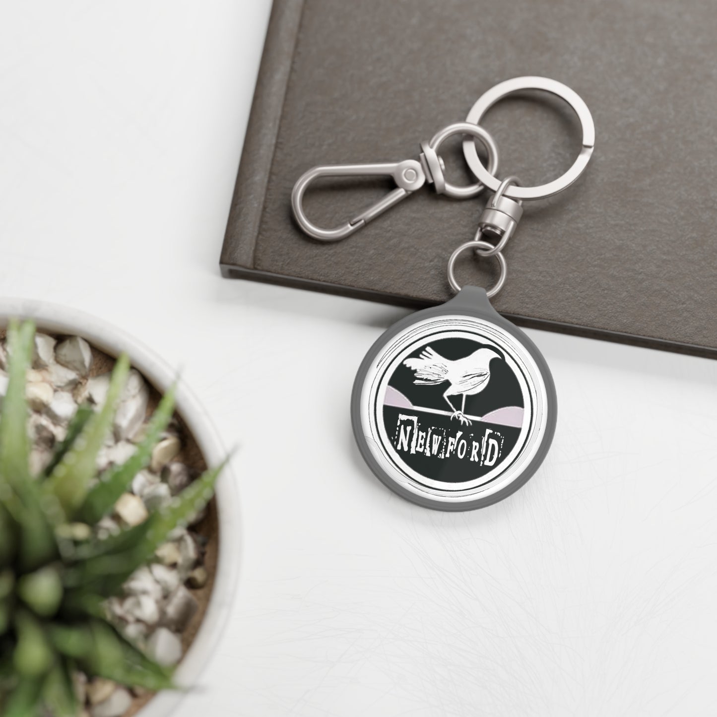 Newford White Crow Keyring Tag